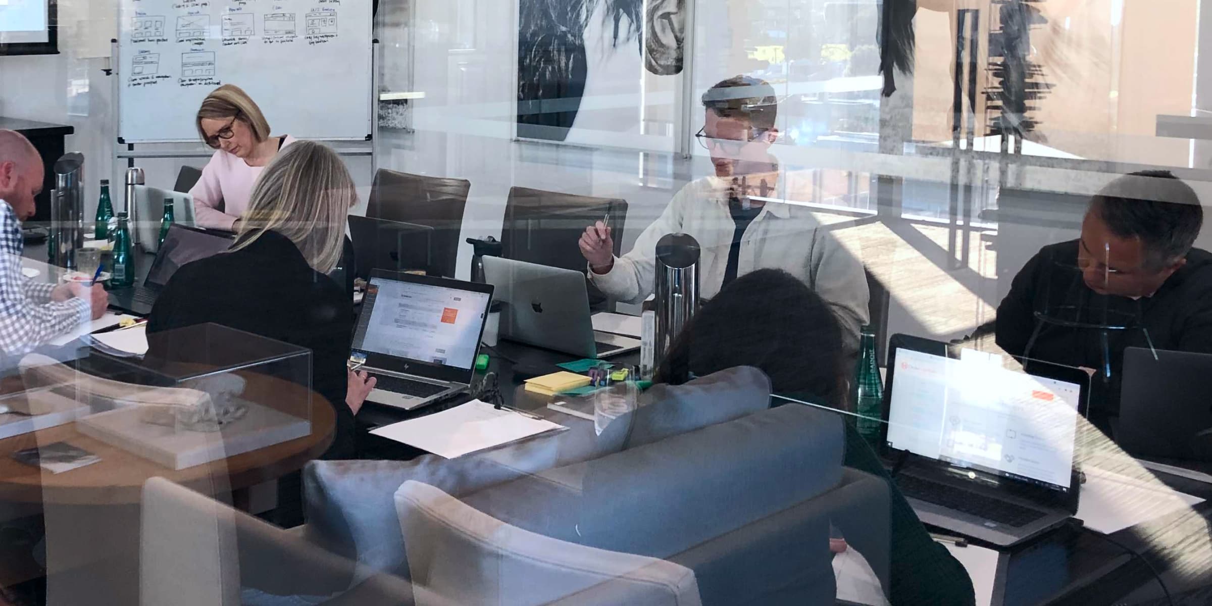 People working on laptops at a table